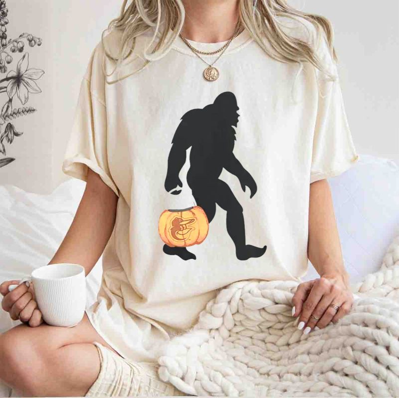 Baltimore Orioles Bigfoot Carrying Pumpkin Halloween T Shirt t shirt 1 1