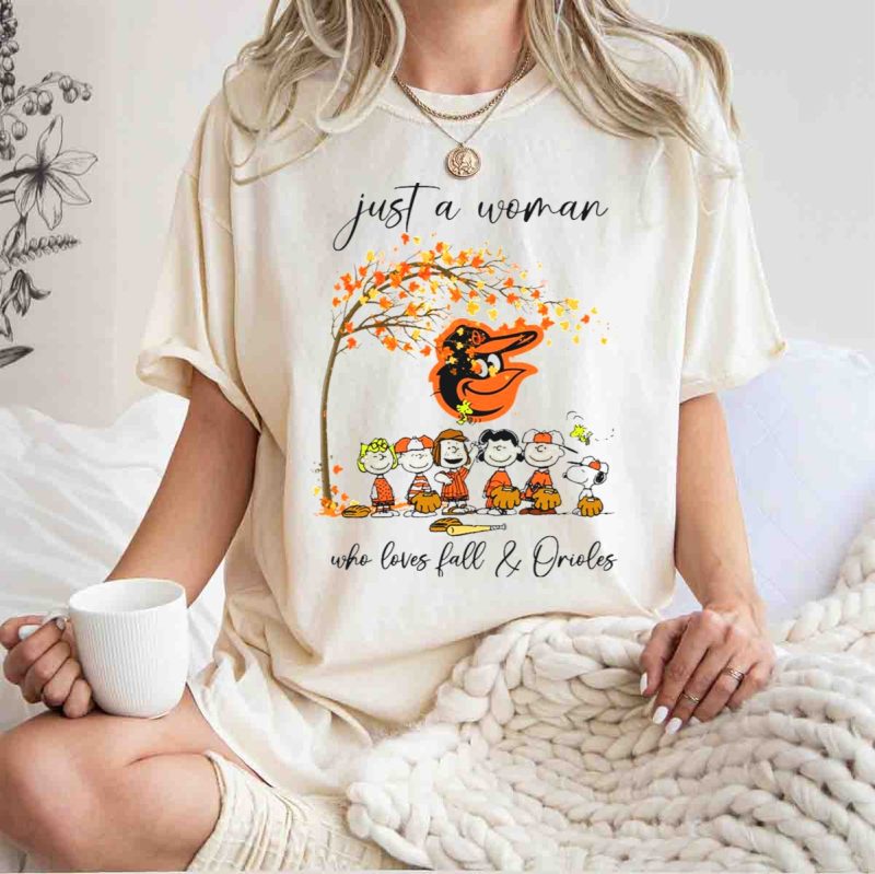 Just a Woman Who Loves Fall and Orioles Peanuts Football Thanksgiving T Shirt t shirt 1 1